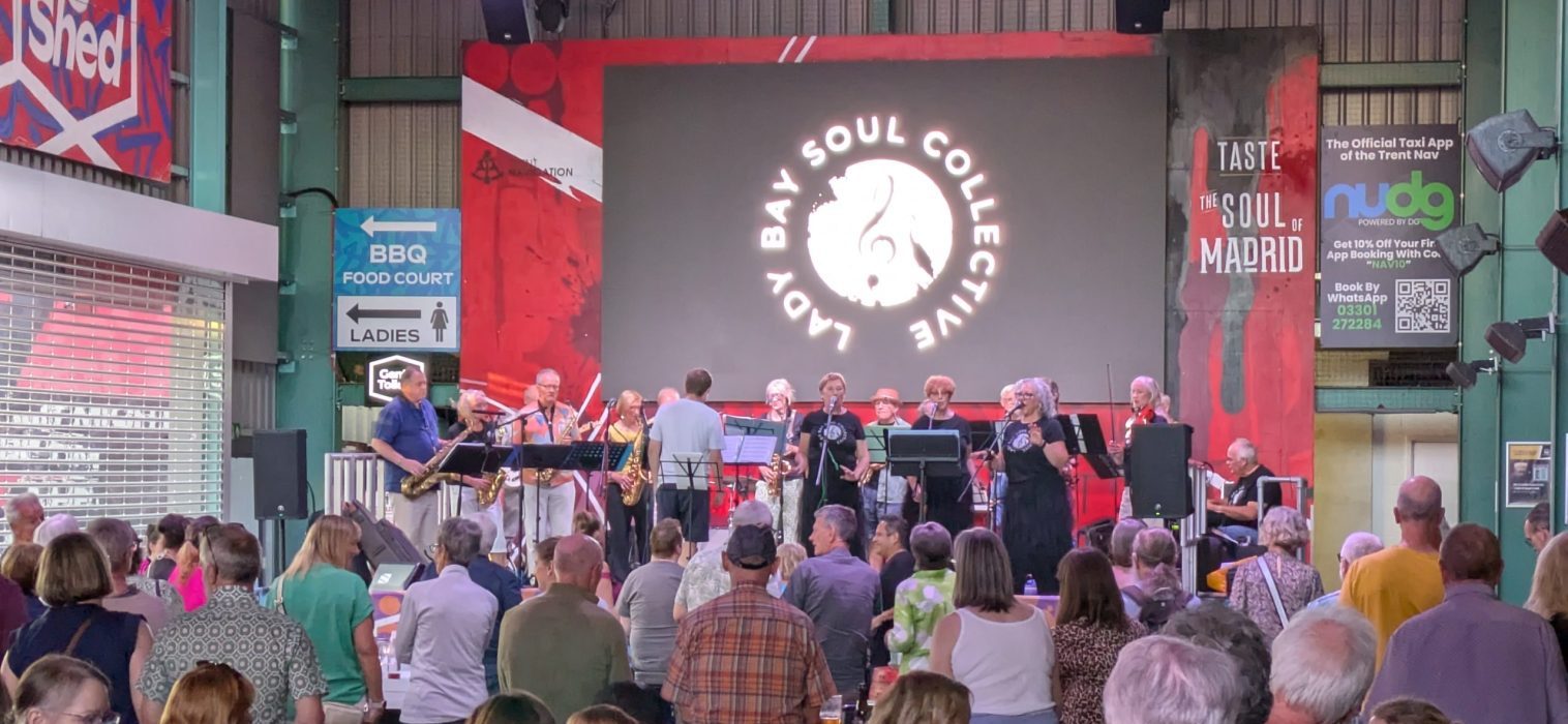 Soul Collective band playing with audience in foreground