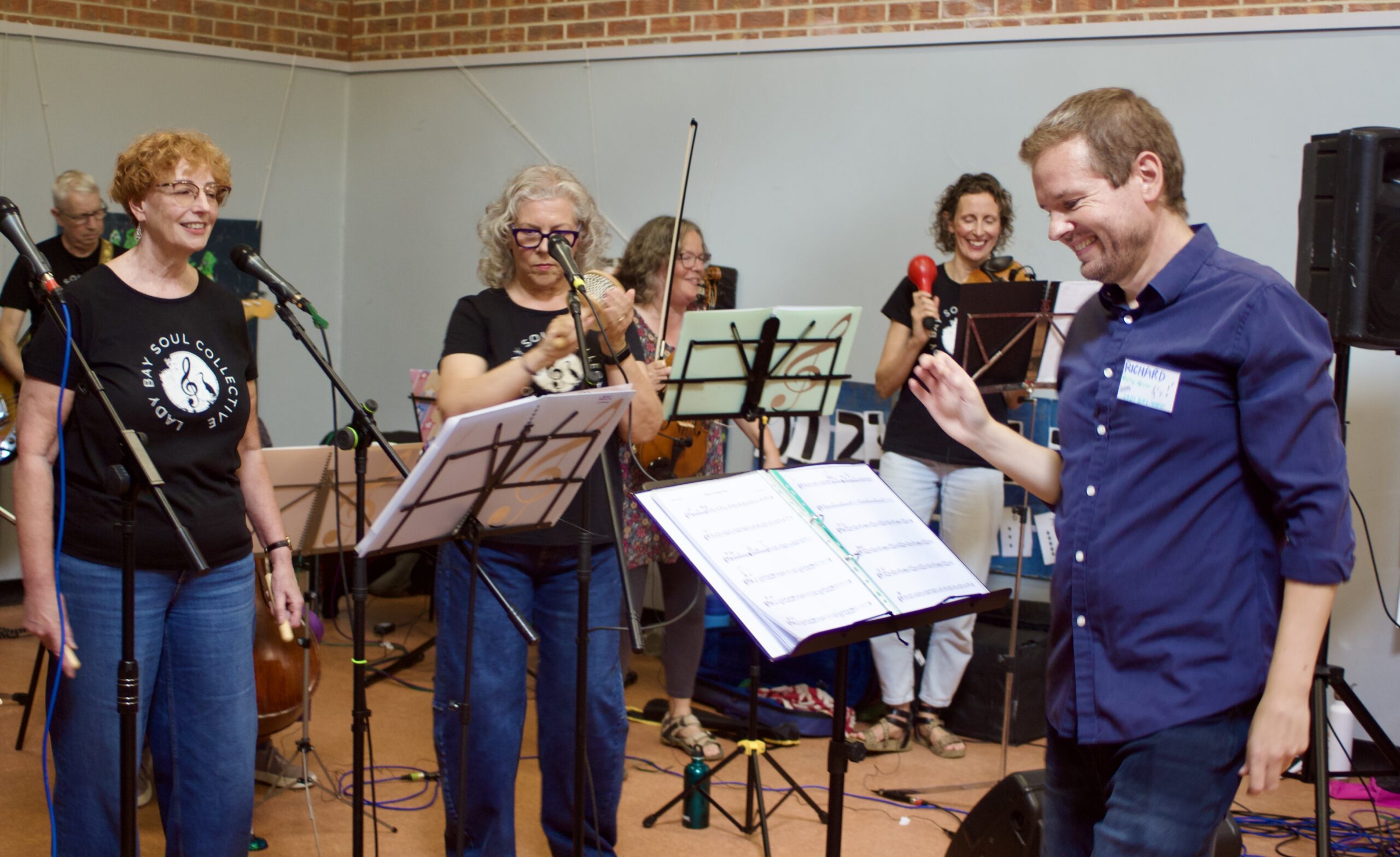 Richard Coffey-Glover on right conducting the lady bay music soul band